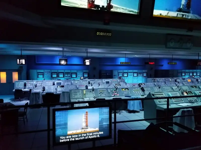 a room with many screens and monitors